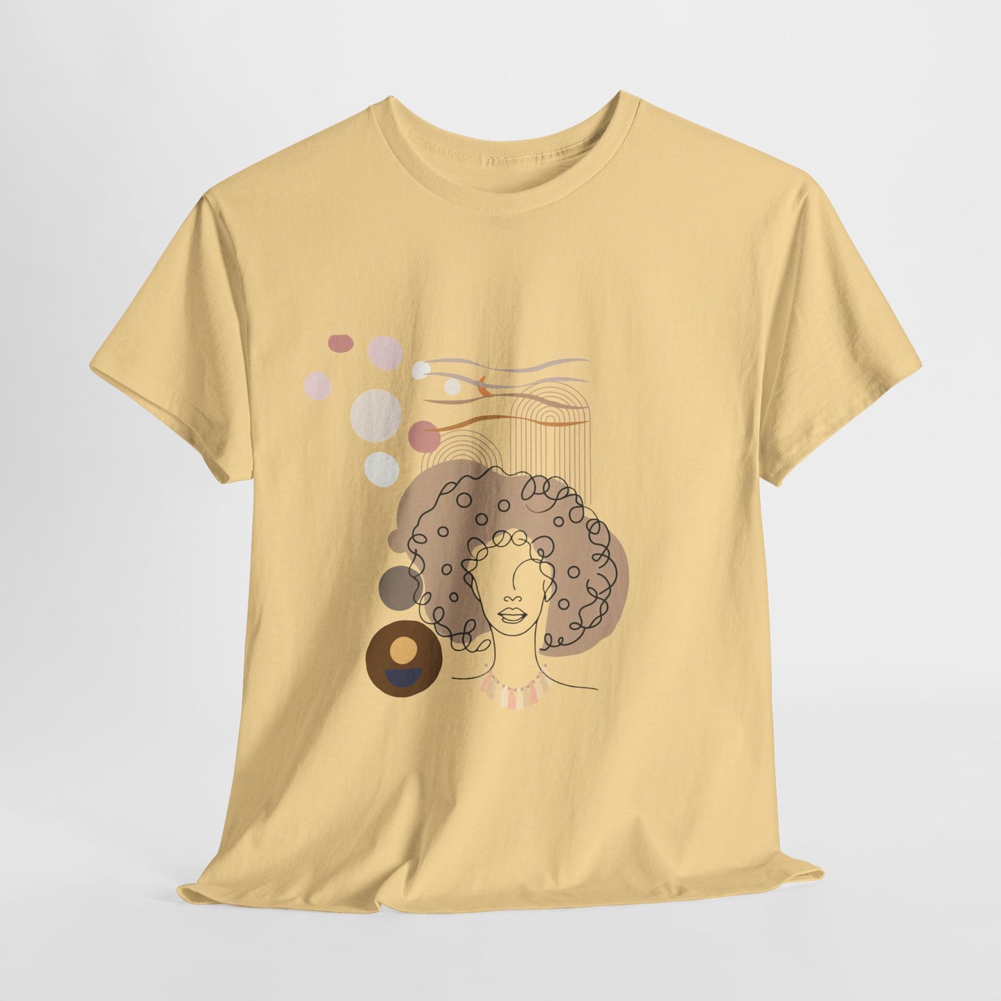 Unisex heavy cotton tee featuring bold abstract patterns inspired by Afro culture. A stylish boho fashion piece perfect for casual outings, art gallery visits, and coffee dates. Unique apparel for trendsetters and art lovers.