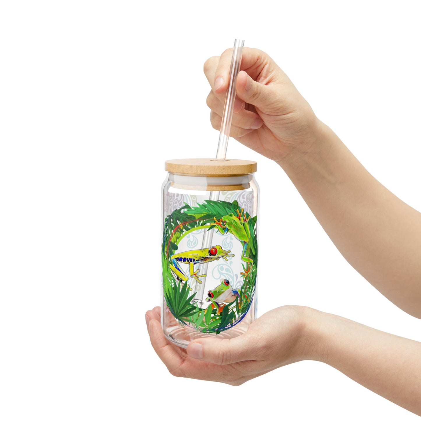 Eco-friendly 16oz tropical sipper glass with a bamboo lid, featuring a vibrant rainforest-inspired frog design—perfect for nature lovers and stylish drinkware collectors.







