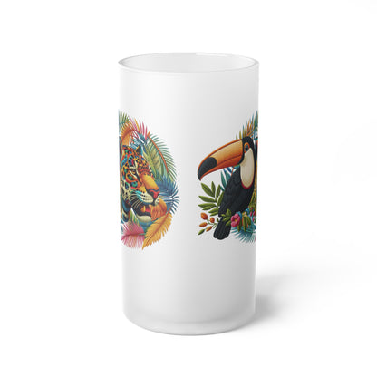 Eco-friendly frosted glass beer mug featuring artwork of a majestic jaguar and colorful toucan, perfect for tropical wildlife enthusiasts. Ideal for bars, man caves, or home settings, this premium mug combines nature-inspired design with sustainability. Enjoy your favorite beer in style while contributing to environmental protection.